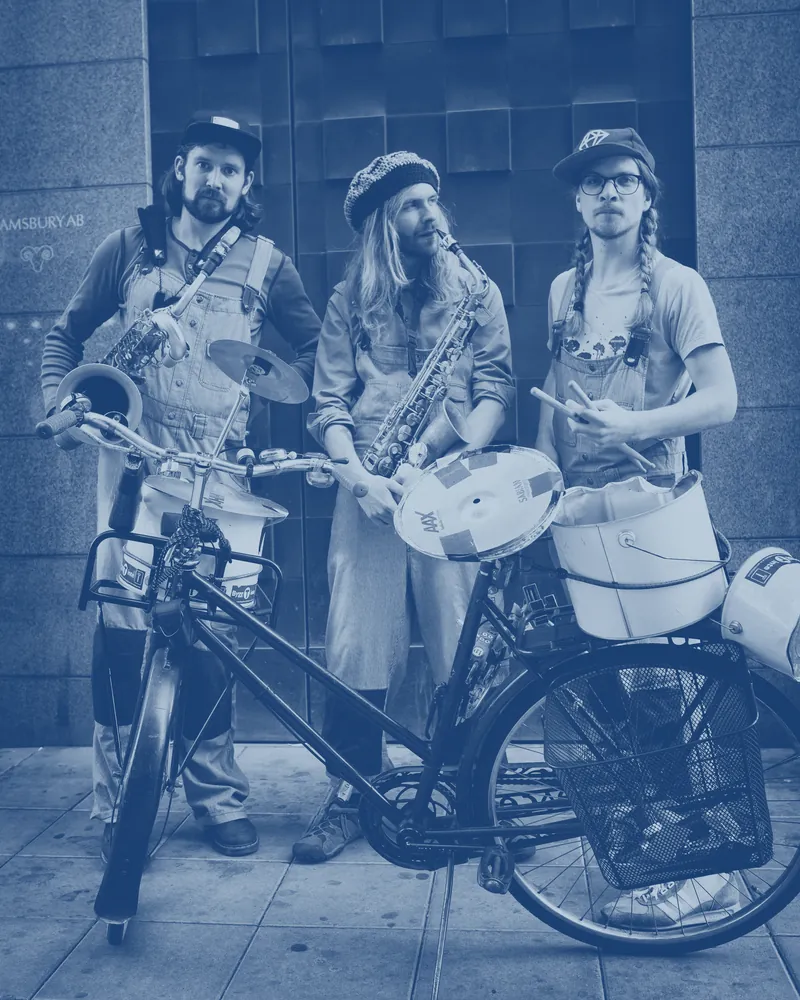 Johan, Mårten and Björn with a bicycle, a drum and saxophones.